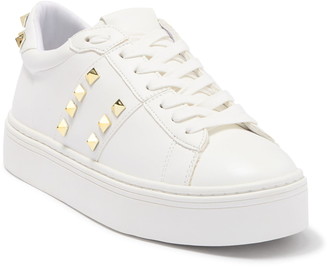 white sneakers with gold studs