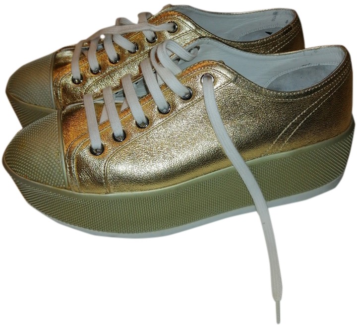 prada gold sneakers