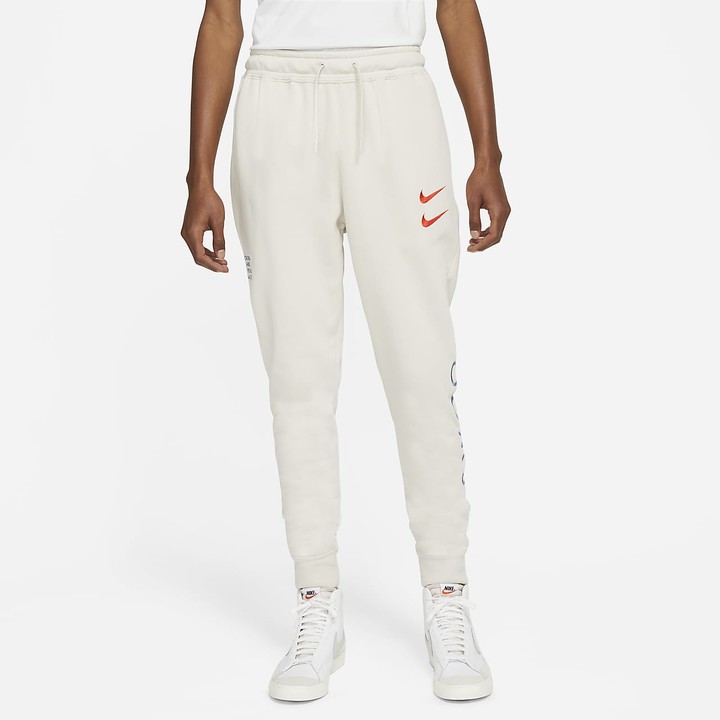 nike track pants swoosh