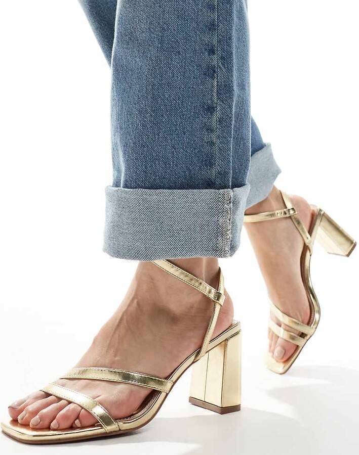 ASOS DESIGN Wide Fit Hampstead mid heeled sandals in gold ShopStyle