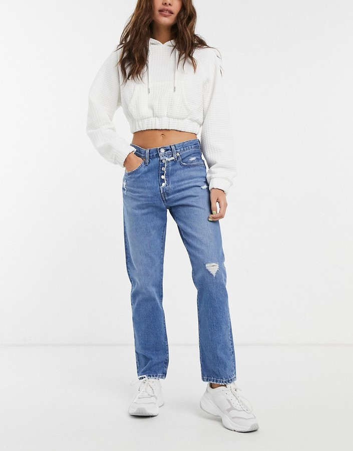 Levi's 501 crop jeans with knee abrasions in mid wash blue - ShopStyle