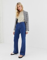 Thumbnail for your product : ASOS DESIGN full length flare jeans with pressed crease and western pockets in mid vintage wash