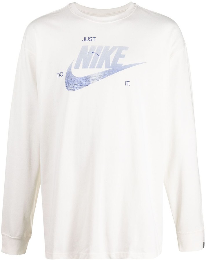 white nike shirt with black swoosh