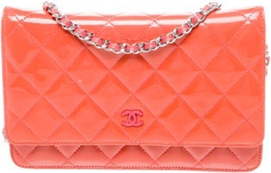 Chanel Shoulder Bag From the 2012-2013 Collection by Karl Lagerfeld Orange Patent Leather Interlocking CC Logo, Quilted Pattern & Chain-Link Accent Silver-Tone Hardware Chain-Link Shoulder Strap Single Exterior Pocket Grosgrain Lining & Four Interior Pockets with Card Slots Snap Closure at Front