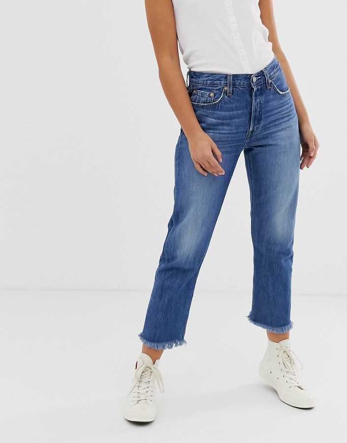 Levi's 501 crop jeans with raw hem in midwash blue - ShopStyle