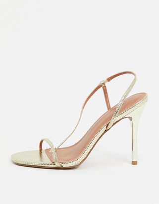 ASOS DESIGN Wide Fit Nevada strappy heeled sandals in gold snake