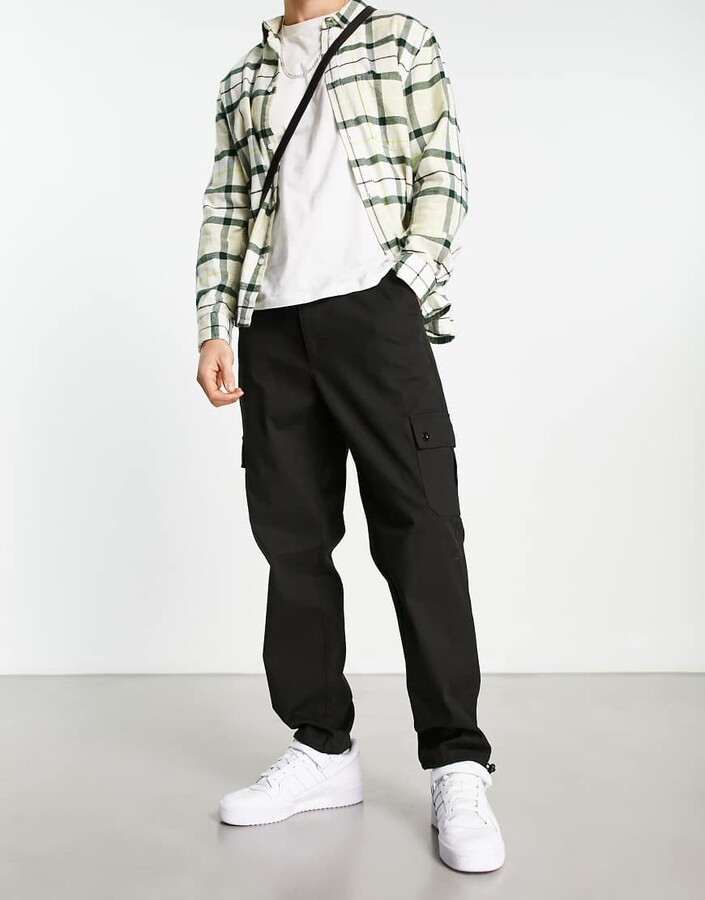 ASOS DESIGN tapered cargo pants with toggles in black