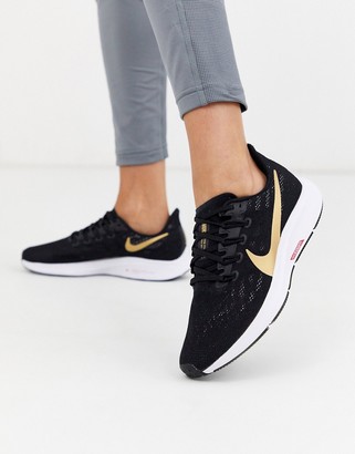 black nike shoes with gold swoosh women's