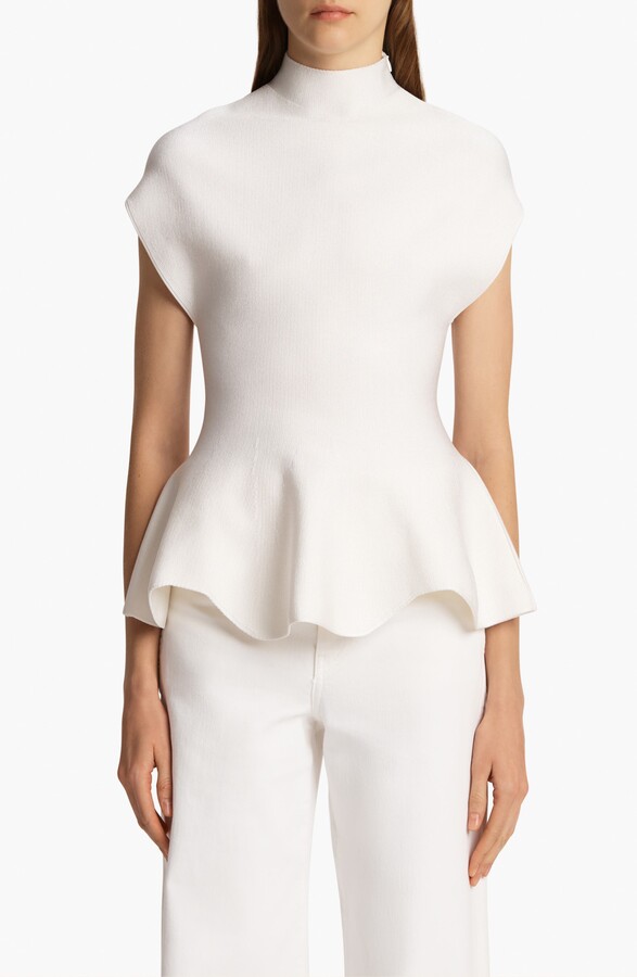 KHAITE Andra Mock Neck Peplum Knit Top