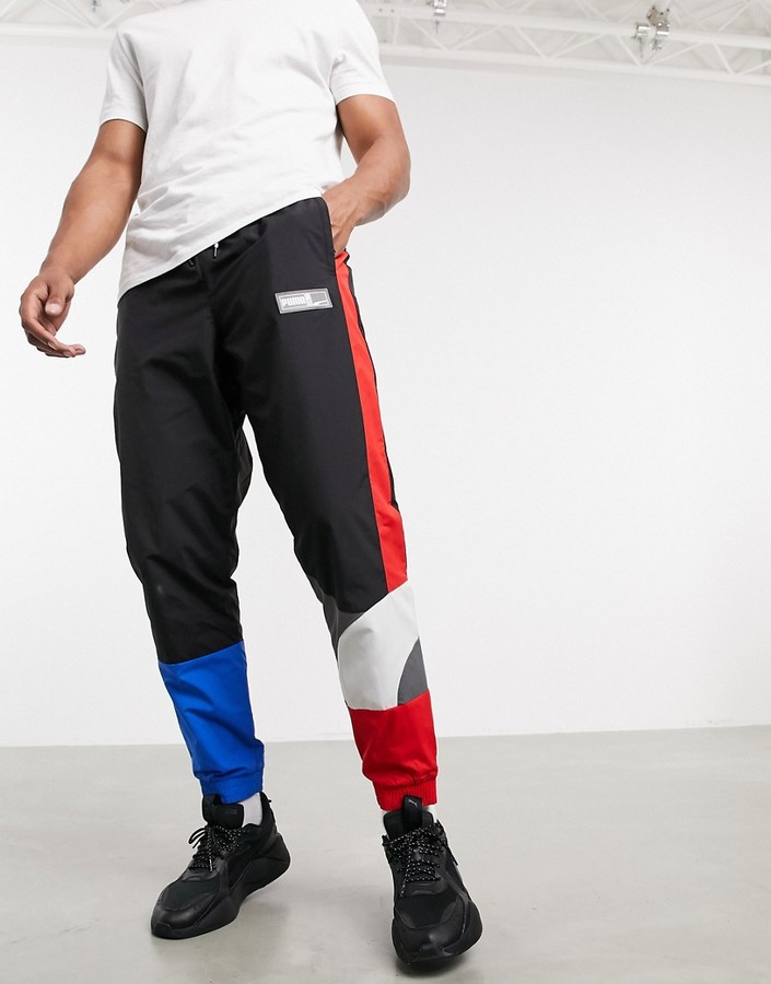 Puma Hoops color block track pants in black and red - ShopStyle