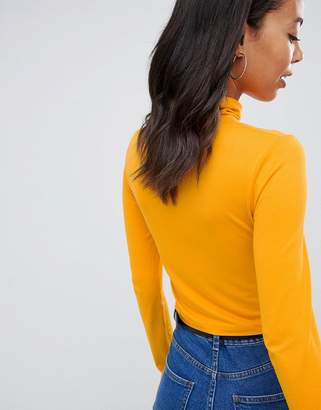 ASOS Tall DESIGN Tall turtle neck crop top with long sleeve in mustard