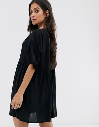 ASOS DESIGN Petite v neck button through mini smock dress in black