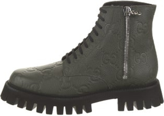 Gucci Leather Ankle Combat Boots Black GG Logo Rubber Trim Round-Toes Exposed Zip Closure at Sides Includes Box & Dust Bag