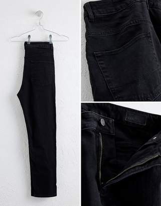 ASOS DESIGN tapered jeans in black