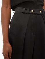 Thumbnail for your product : Balmain Pleated Silk-satin Tapered Trousers - Black