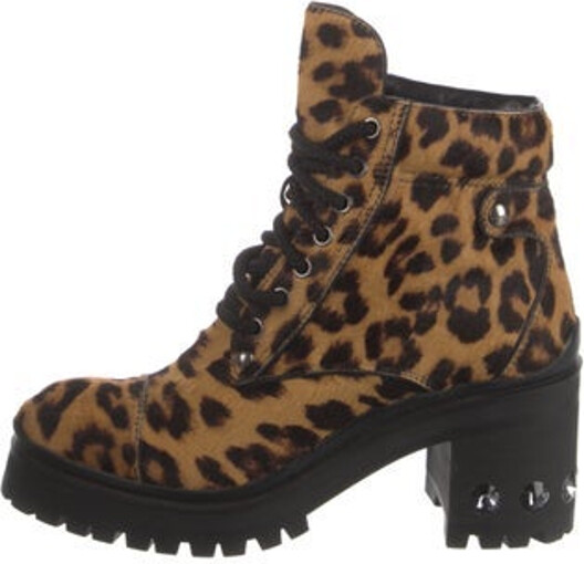 Miu Miu Ponyhair Ankle Combat Boots Neutrals Animal Print Round-Toes with Crystal Embellishments Lace-Up Closure at Uppers Size not listed, estimated from measurements. Designer