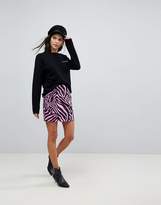 Thumbnail for your product : ASOS DESIGN Denim Mini Skirt in Pink Zebra Print