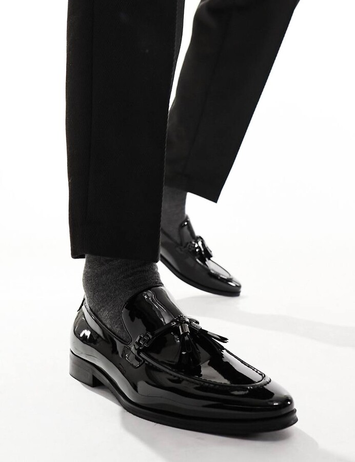 ASOS DESIGN patent faux leather loafers in black with tassel