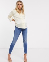 Thumbnail for your product : ASOS DESIGN Maternity high rise ridley 'skinny' jeans in mid wash blue with rips with over the bump band
