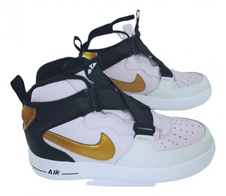 white and turquoise nike shoes