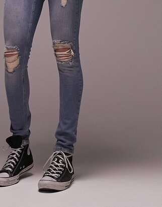 Topman heavy rip spray on jeans in mid wash tint