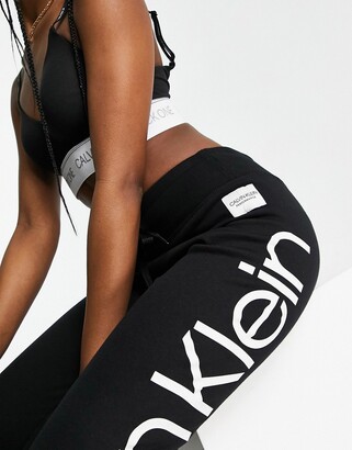 Calvin Klein jumbo logo full length cuff sweatpants in black - ShopStyle Activewear Pants