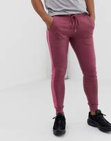 Thumbnail for your product : ASOS Design DESIGN skinny joggers with side stripe in purple
