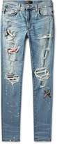 Thumbnail for your product : Amiri Skinny-Fit Appliqued Distressed Stretch-Denim Jeans - Men - Blue