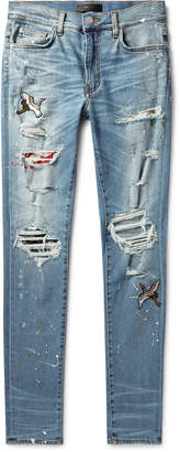 Amiri Skinny-Fit Appliqued Distressed Stretch-Denim Jeans - Men - Blue