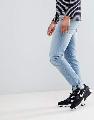 ASOS Design Tall Stretch Slim Jeans In Mid Wash With Abrasions