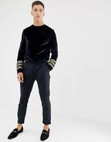 Thumbnail for your product : ASOS Design DESIGN longline long sleeve t-shirt with sleeve taping in velour in navy