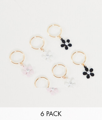 ASOS DESIGN pack of 6 hair rings in gold with daisy design - ShopStyle
