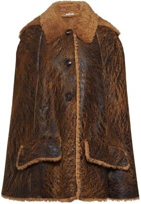 fur lined cape coat