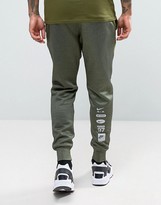 Thumbnail for your product : Nike Air Joggers In Tapered Fit In Green 832152-331