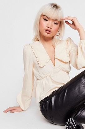 cream ruffle top