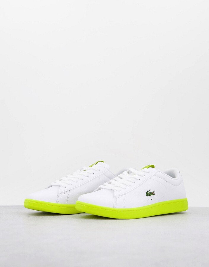 Lacoste carnaby evo sneakers with contrast sole in white/yellow - ShopStyle