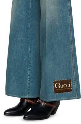 Gucci Stonewashed denim flare trousers