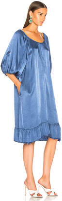 Raquel Allegra Pebble Satin Peasant Ruffle Dress in French Blue | FWRD