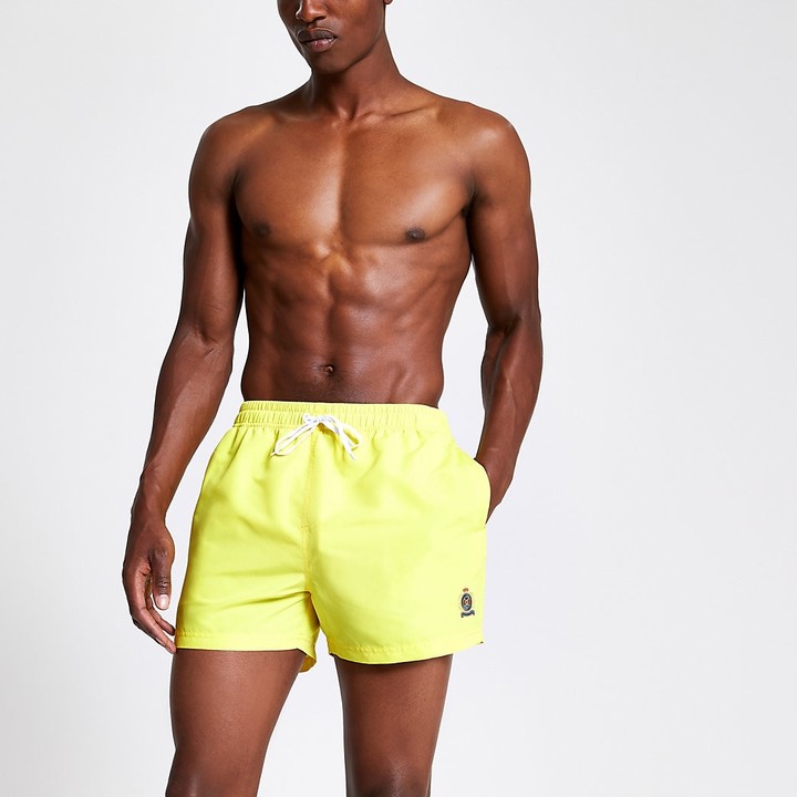neon yellow swim trunks