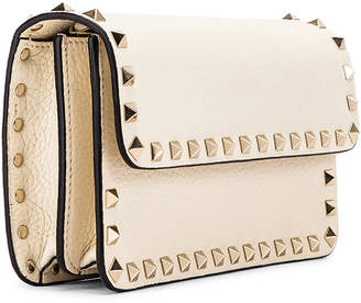 Valentino Rockstud Flap Crossbody Bag in Light Ivory | FWRD