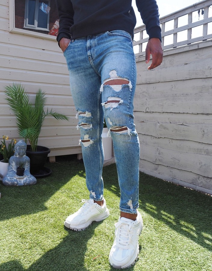 Bershka super skinny jeans with rips in blue - ShopStyle