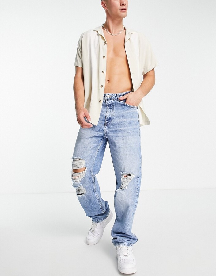 Bershka baggy ripped jeans in blue - ShopStyle