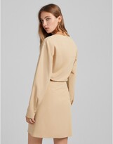 Thumbnail for your product : Bershka twist front shirt dress in beige