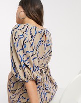 Thumbnail for your product : Vero Moda skater dress with puff sleeve and lace back detail in nude abstract print