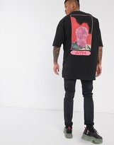 Thumbnail for your product : ASOS DESIGN oversized longline t-shirt with front and back print in acid wash with nibbled neck detail and side splits
