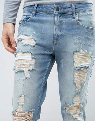 ASOS Stretch Slim Jeans In Vintage Mid Wash With Heavy Rips