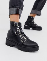 black flat buckle boots
