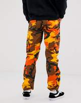 Thumbnail for your product : Reclaimed Vintage Revived camo cargo pants in orange