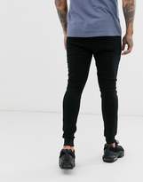 Thumbnail for your product : ASOS Design DESIGN super skinny joggers in black with silver zip pockets