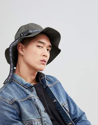 ASOS Design Bucket Hat In Khaki With Aztec Band And Fastening Detail